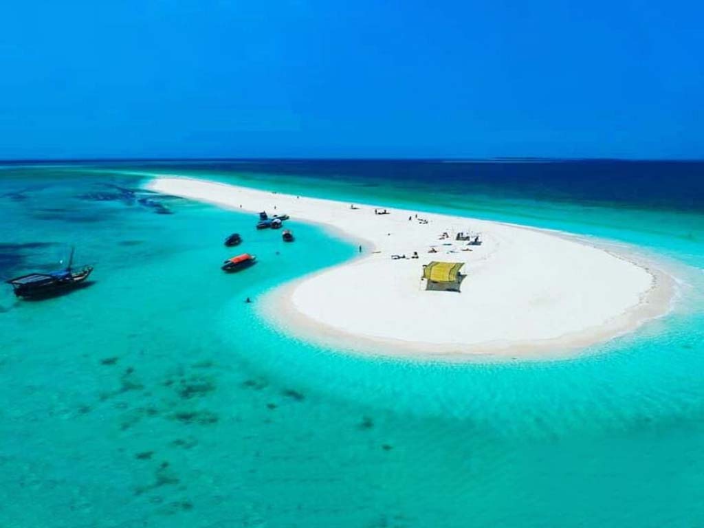 White sandy beach and crystal-clear waters at Nakupenda Island, a must-visit via speedboat charters in Zanzibar